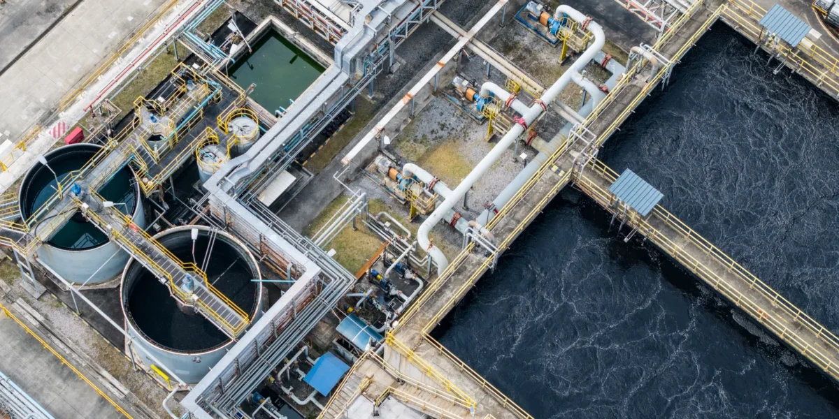 Overhead view of industrial wastewater tanks and connecting pipework